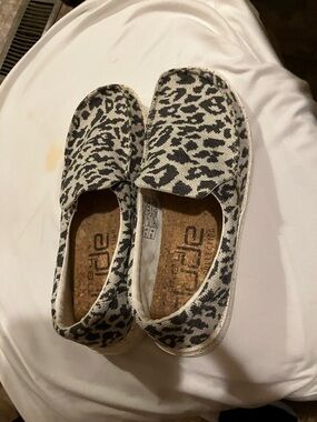 Hey Dude Women's Leopard Print Slip-On Sneakers in White and Black
